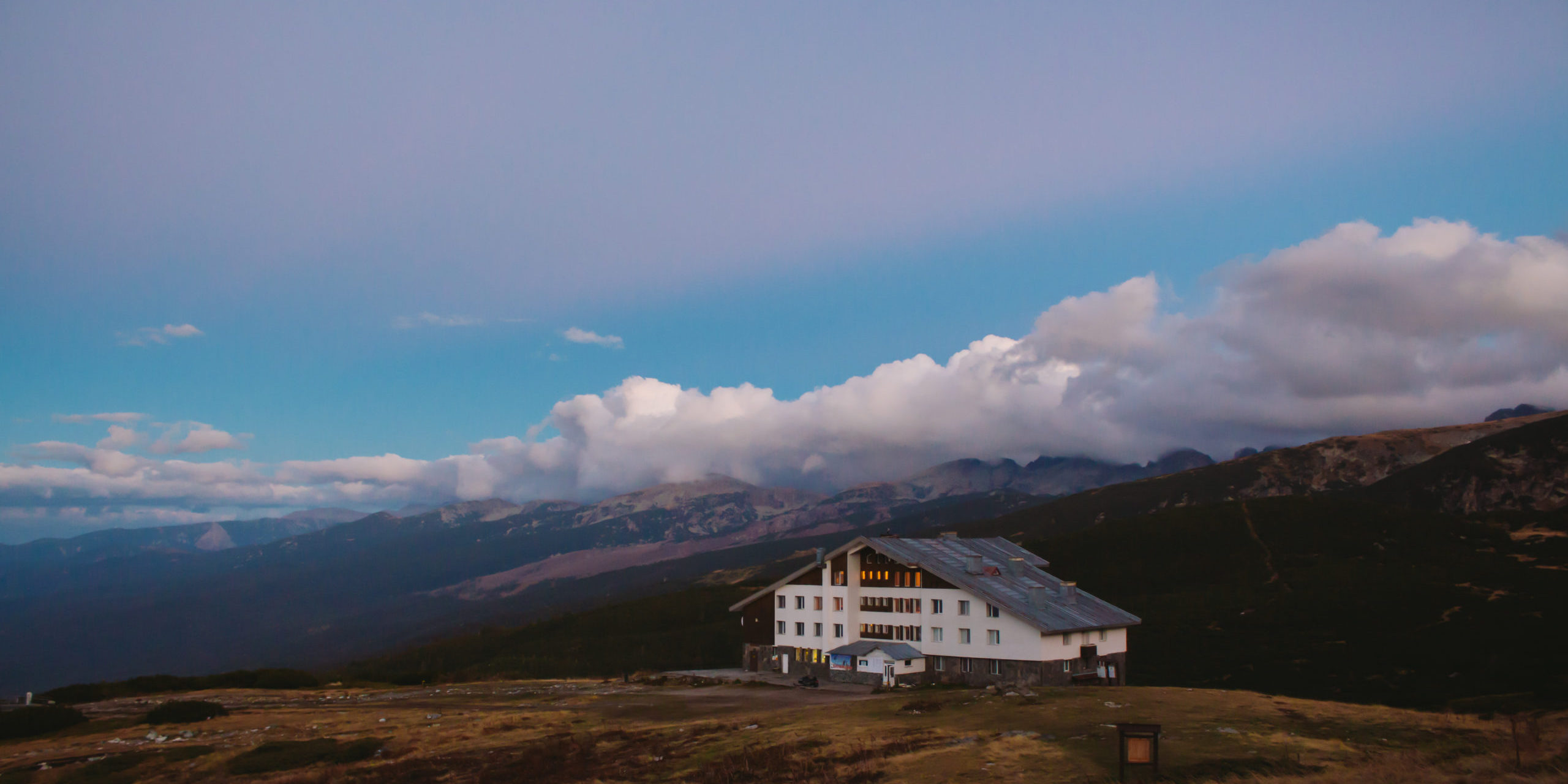 house in the mountains of Bulgaria at sunset.