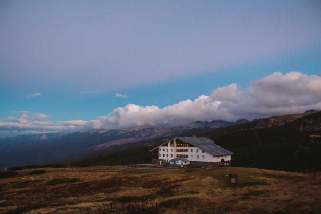 house in the mountains of Bulgaria at sunset.